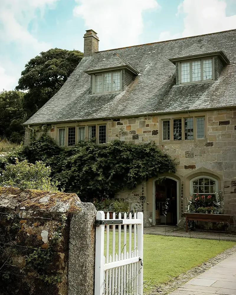 House & Heritage cottage exterior with a whit garden gate